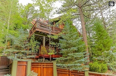 Perched among the trees in sought-after Moonridge, this - photo 2