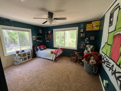 This spacious 5-bed, 3-bath walk-out home on Rainy River offers - photo 23