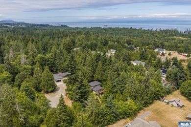 Amongst the trees on an acre this lovely 4 bed 2.5 bath home is - photo 2
