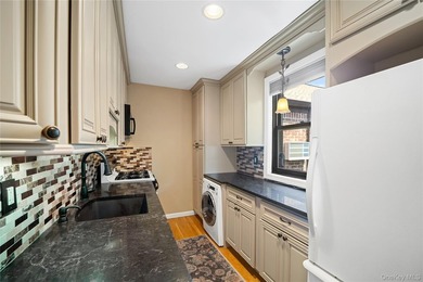This desirable upper-level 2-bedroom cooperative in the - photo 2