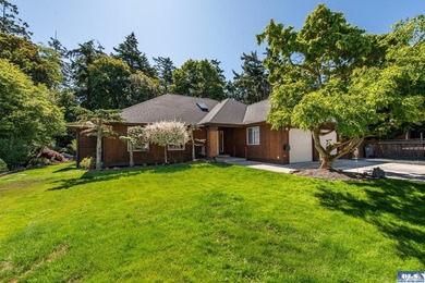 Nestled on a peaceful street in Sequim, this property backs - photo 1
