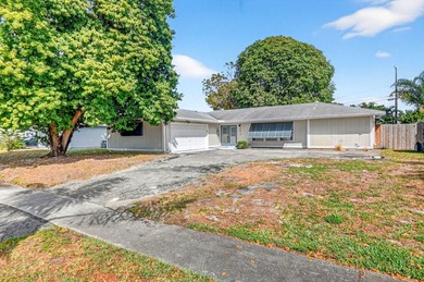 Welcome to this charming 4-bedroom, 2-bathroom home with a 2-car - photo 1