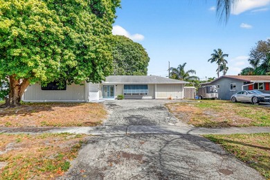 Welcome to this charming 4-bedroom, 2-bathroom home with a 2-car - photo 2