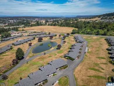 Enjoy easy living in this beautifully situated end-unit condo in - photo 9