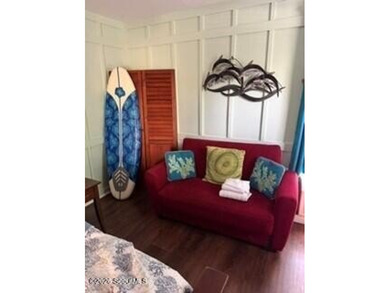 Discover the charm of Pier Village in this beautifully located - photo 3