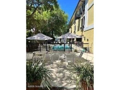 Discover the charm of Pier Village in this beautifully located - photo 8