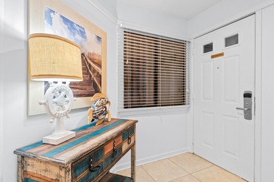 This move-in ready, updated two-bedroom, two-bath condo features