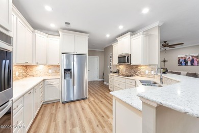 Welcome to this stunning, custom-built 2020 brick home in a