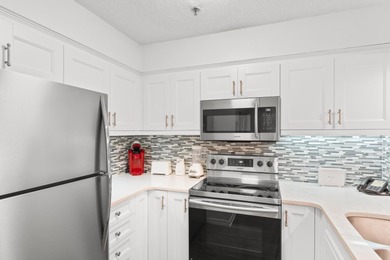 This move-in ready, updated two-bedroom, two-bath condo features