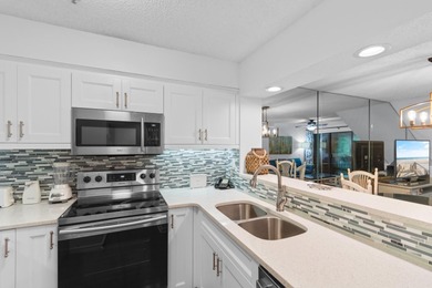 This move-in ready, updated two-bedroom, two-bath condo features