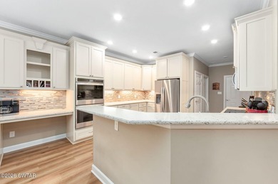 Welcome to this stunning, custom-built 2020 brick home in a