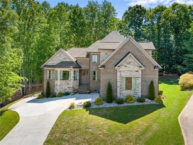 Constructed with a brick and stone exterior and highlighted by - photo 1