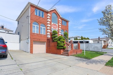 Welcome to this beautiful two-family home in the highly - photo 1