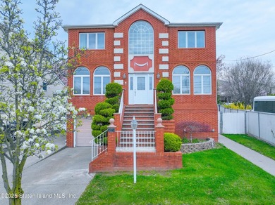 Welcome to this beautiful two-family home in the highly - photo 2