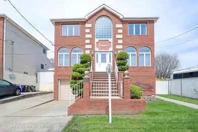 Welcome to this beautiful two-family home in the highly - photo 3