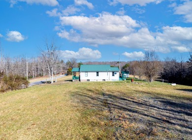 This older farm house sits on 6 beautiful acres of flat open
