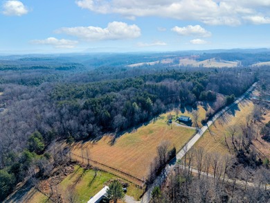 This older farm house sits on 6 beautiful acres of flat open