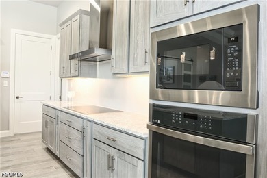 Welcome to modern luxury living at its best! This barely - photo 34