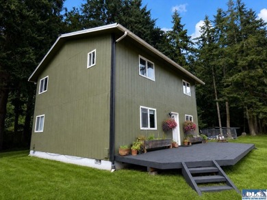Tucked among mature trees and lovingly maintained, this inviting - photo 1