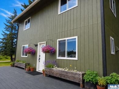 Tucked among mature trees and lovingly maintained, this inviting - photo 2