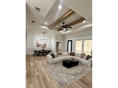 Welcome to this cozy 4-bedroom, 2-bathroom retreat nestled in - photo 3