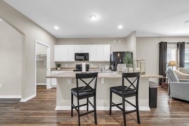 Located in Schooner Landing at Hammock Bay, this 3-bedroom - photo 3