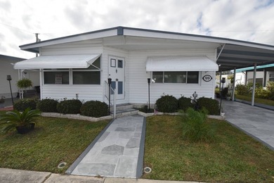 This immaculate home full of upgrades and renovations sits steps - photo 2