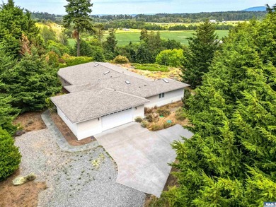 Wake up to sweeping mountain and valley views in one of Sequim's