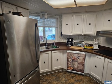 Very well kept home in Juniper Mobile Estates. This home is - photo 10