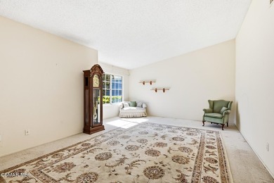 Highly desirable Cape Cod single story end unit! This charming