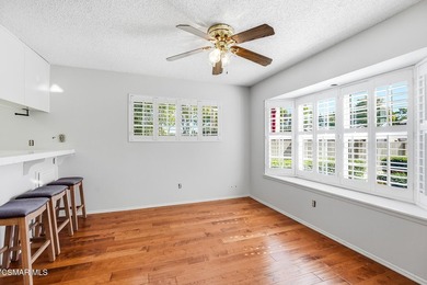 Highly desirable Cape Cod single story end unit! This charming