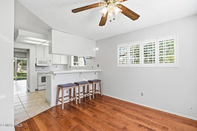 Highly desirable Cape Cod single story end unit! This charming