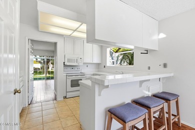 Highly desirable Cape Cod single story end unit! This charming