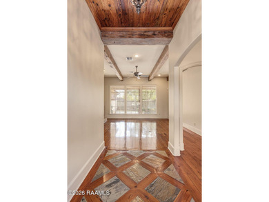 Located within the gated Le Triomphe community, this French - photo 4