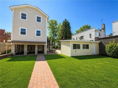 Discover a rare opportunity to own a fully detached two-family - photo 8