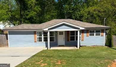 Lake Home For Sale in Flowery Branch, Georgia