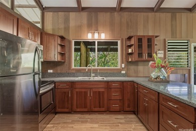 Nestled in lush Tantalus, above the Honolulu cityscape, this - photo 3