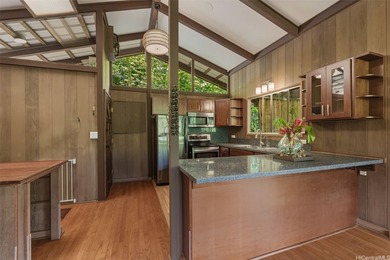 Nestled in lush Tantalus, above the Honolulu cityscape, this - photo 4