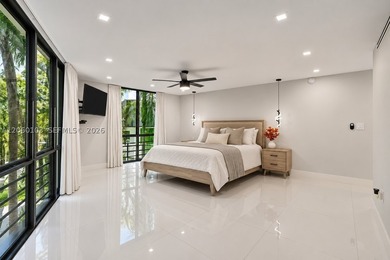 Step off the elevator on the second floor and into a home that - photo 11