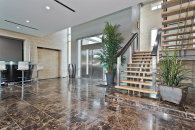 This stunning contemporary home sits gracefully on a prominent - photo 3