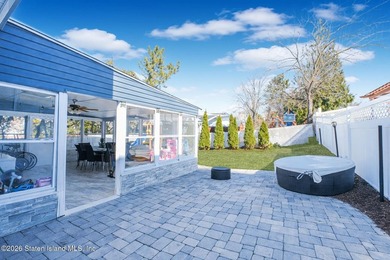 Welcome to 191 Suffolk Avenue, a warm and inviting two-family - photo 2