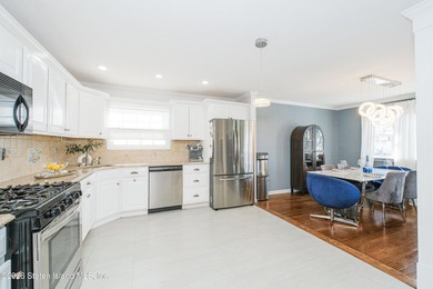 Welcome to 191 Suffolk Avenue, a warm and inviting two-family - photo 5