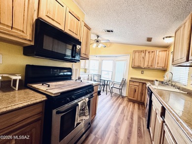 Step into this vibrant manufactured home just minutes from the