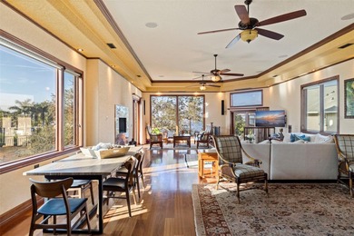 Commanding a premier position at the point of Bayou Grande, this