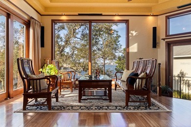 Commanding a premier position at the point of Bayou Grande, this