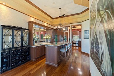 Commanding a premier position at the point of Bayou Grande, this