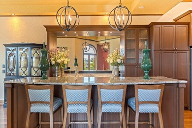 Commanding a premier position at the point of Bayou Grande, this