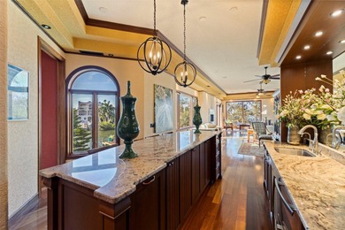 Commanding a premier position at the point of Bayou Grande, this