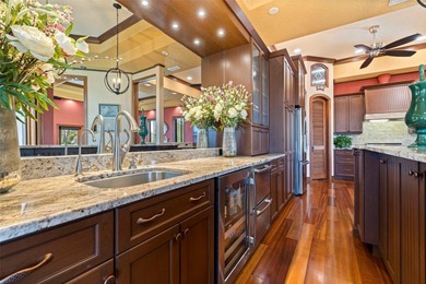 Commanding a premier position at the point of Bayou Grande, this