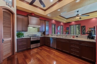 Commanding a premier position at the point of Bayou Grande, this